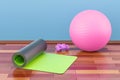 Fitness and sports equipment concept. Yoga mat, dumbbells and fi