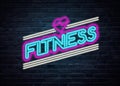 Fitness and sports neon sign on a brick wall Royalty Free Stock Photo