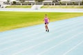 Fitness, sports woman and running on race track for athletics, sprint challenge or competition training in stadium Royalty Free Stock Photo