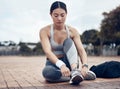 Fitness, sports and woman with shoes ready to start running outdoors for exercise, raining and cardio workout. Young Royalty Free Stock Photo