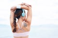 Fitness, sports and woman stretching with music on in warm up for training, cardio exercise and running workout. Tattoo