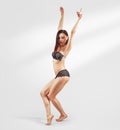 Fitness sporty girl dancing hip hop in the studio, urban style. Teen model in underwear posing. Royalty Free Stock Photo