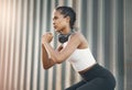 Fitness, squat and woman exercise in city or shipping dock listening to music, audio and track. Sports, healthy body and Royalty Free Stock Photo