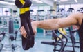 Fitness straps in the hand of man training Royalty Free Stock Photo