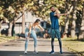 Fitness, stretching and couple rest in park after running, exercise and workout together in city. Health, wellness and Royalty Free Stock Photo