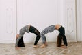 Fitness, stretching practice, group of two attractive women doing yoga. Wellness concept Royalty Free Stock Photo