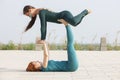 Fitness, stretching practice, group of two attractive women doing yoga. Wellness concept Royalty Free Stock Photo