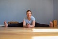 Pregnant woman working out doing Seated straddle posture, Upavishtha Konasana