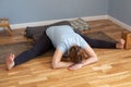 Pregnant woman working out doing Seated straddle posture, Upavishtha Konasana