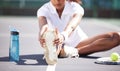 Fitness, stretching and shoes of woman on tennis court for sports, training and competition practice. Workout, exercise