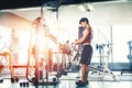 Fitness Strong Man Doing Heavy Weight Exercise on Machine in gym Royalty Free Stock Photo