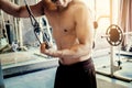 Fitness Strong Man Doing Heavy Weight Exercise on Machine in gym Royalty Free Stock Photo