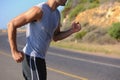 Fitness, sweat and man athlete in mountain running for race, marathon or competition training. Sports, workout and body