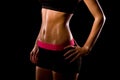 Fitness sweating woman on black background. Royalty Free Stock Photo