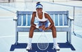 Fitness, tennis and portrait of a woman player sitting on the bench to rest after an outdoor match. Sports, training and Royalty Free Stock Photo