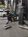 This fitness tool connects the handles to the pile of weights by pulling the cable so that it moves through the pulley. Royalty Free Stock Photo