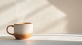 fitness tracker, hand-painted ceramic mug, filled with steaming tea, placed on a clean white surface Royalty Free Stock Photo