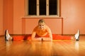 Fitness trainer does splits Royalty Free Stock Photo