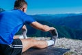 Fitness trainer performing his daily stretching exercises early in the morning Royalty Free Stock Photo