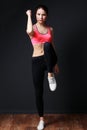 Fitness training in the gym - young energetic woman walks highly Royalty Free Stock Photo