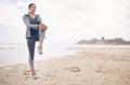 Fitness, warm up and woman athlete on the beach for health and race, marathon or competition training. Sports, workout Royalty Free Stock Photo