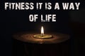 Fitness it is a way of life - white candle with dark background Royalty Free Stock Photo