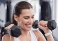 Fitness, weightlifting and smile with woman in gym for training, workout and health. Sports, exercise, and wellness with