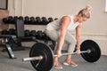 Fitness, weightlifting and a woman bodybuilder in the gym for a workout to build a strong muscular physique. Exercise