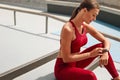 Fitness. Woman Checking Smart Watch Before Workout. Fit Girl In Fashion Sportswear Using Tracker On Her Wrist.