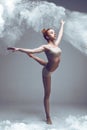 Fitness woman dancer in dust / fog Royalty Free Stock Photo