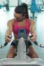 Fitness Woman Doing Exercise For Back On Machine Royalty Free Stock Photo