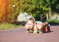 Fitness woman doing exercises during outdoor cross training workout in sunny morning Royalty Free Stock Photo