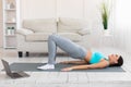 Fitness Woman Doing Pilates Exercise At Laptop During Home Training Royalty Free Stock Photo