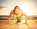 Fitness woman doing push ups Royalty Free Stock Photo