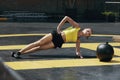 Fitness woman doing side plank exercise workout in gym. Sport Royalty Free Stock Photo