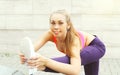 Fitness woman doing warm-up stretching exercise before run, female athlete ready to workout in city, sport and healthy lifestyle Royalty Free Stock Photo