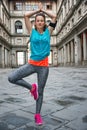 Fitness woman doing yoga near uffizi gallery in florence, italy Royalty Free Stock Photo