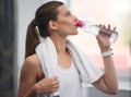 Fitness, woman and drinking water in gym for health, break and energy for workout, training or towel. Thirsty sports Royalty Free Stock Photo