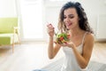 Fitness woman eating healthy food after workout