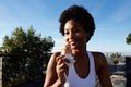 Fitness woman eating ice cream at the beach Royalty Free Stock Photo