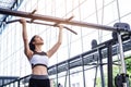 Fitness woman exercise workout with exercise-machine pull up on bar in fitness center gym. healthy lifestyle Concept Royalty Free Stock Photo