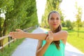 Fitness woman exercising stretching out doing workout in the park. Brazilian female fitness model portrait Royalty Free Stock Photo