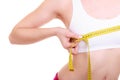 Fitness woman fit girl with measure tape measuring her bust Royalty Free Stock Photo