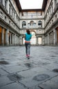 Fitness woman jogging near uffizi gallery in florence, italy. re Royalty Free Stock Photo