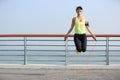 Fitness woman jumping rope at seaside Royalty Free Stock Photo