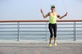 Fitness woman jumping rope at seaside Royalty Free Stock Photo