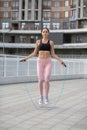 Fitness woman jumping with skipping rope Royalty Free Stock Photo