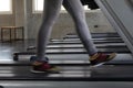 Fitness woman in leging sportware walking on treadmill machine Royalty Free Stock Photo