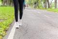 Fitness woman legs exercise walking on park trail in the morning. Royalty Free Stock Photo