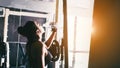 Fitness woman in loft gym drinking water After a good workout